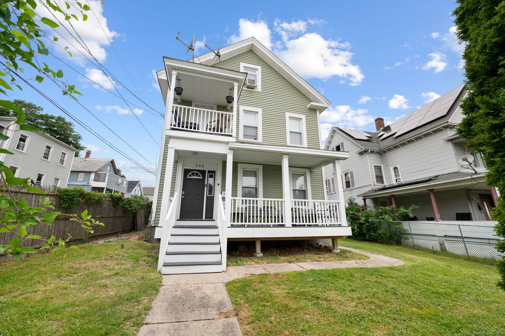 845 Bank Street New London, CT 06320 - Photo 1 of 1 a front view of a house with a yard