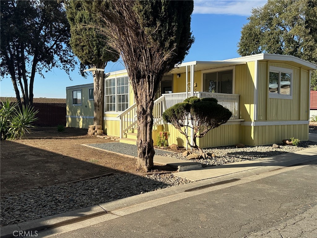 3549 Esplanade, Unit 402 Chico, CA 95973 - Photo 10 of 11 a front view of a house with a tree