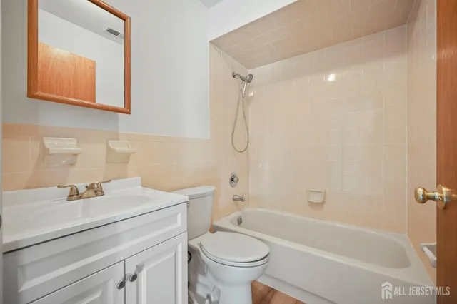 a bathroom with a sink a toilet and a bathtub