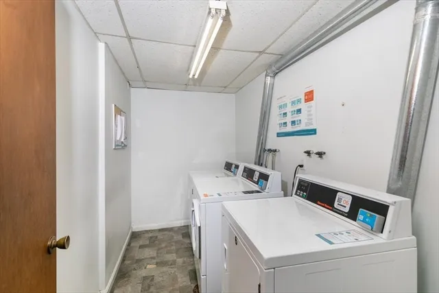 a view of a hallway with wooden floor and entryway