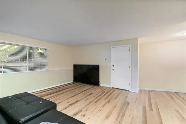 a bedroom with a bed a couch and dresser