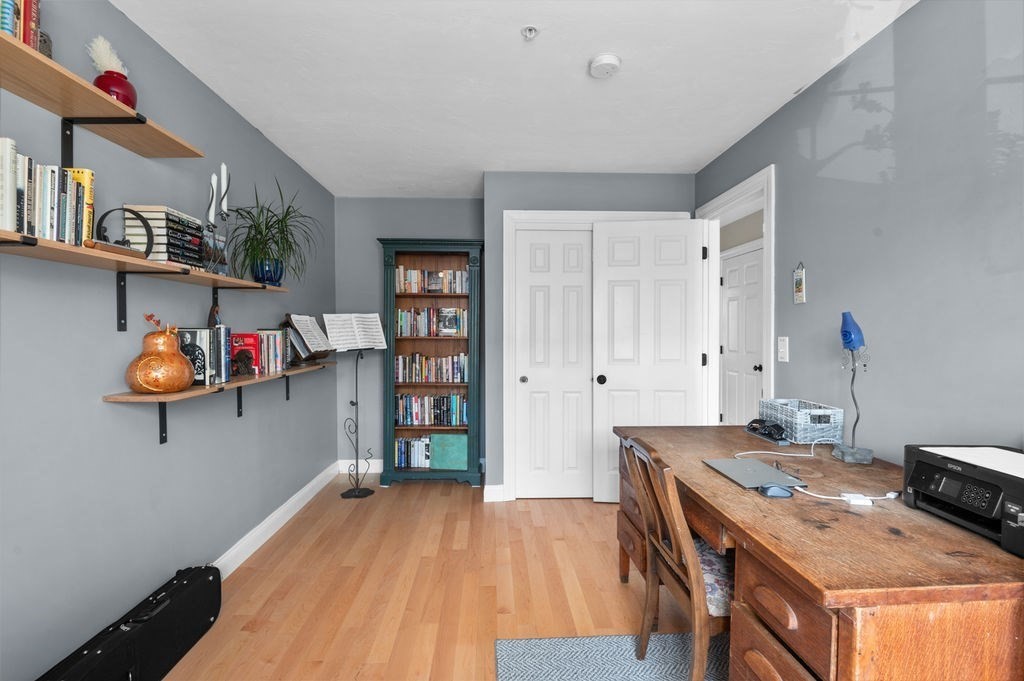 28 West Street, Unit 4A Ayer, MA 01432 - Photo 18 of 37 a room with a table and chairs