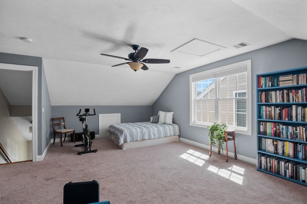 28 West Street, Unit 4A Ayer, MA 01432 - Photo 19 of 37 a living room with furniture and a book shelf