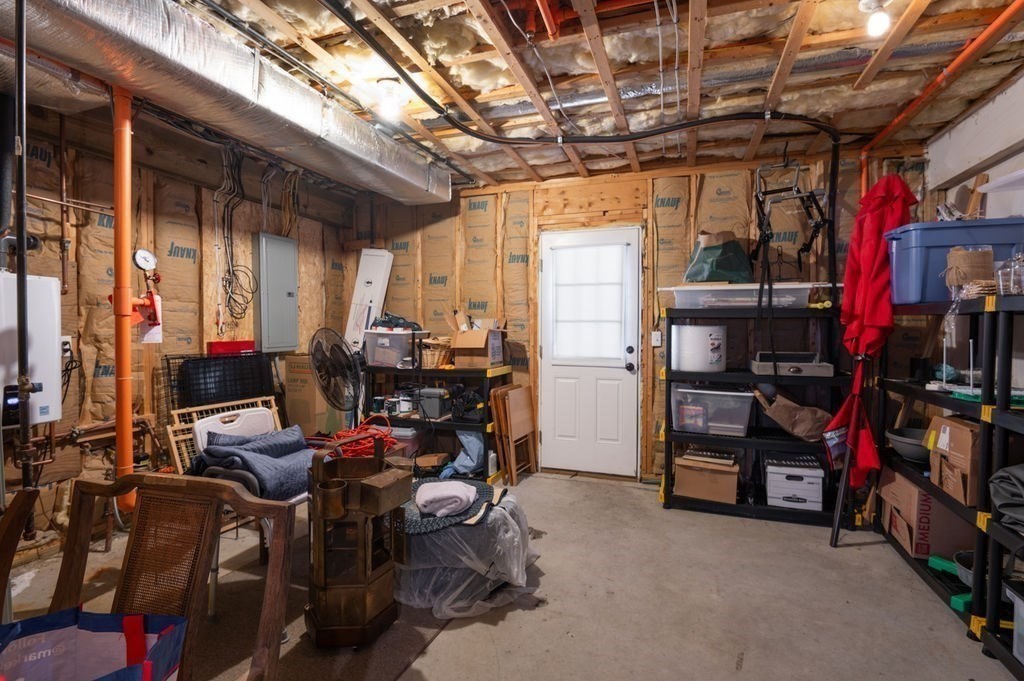 28 West Street, Unit 4A Ayer, MA 01432 - Photo 37 of 37 a view of walk in closet with clothes and shoes