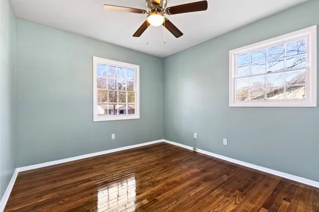 a view of room with window and ceiling fan