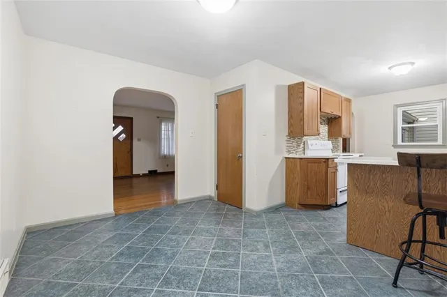 a view of a kitchen with furniture and cabinets