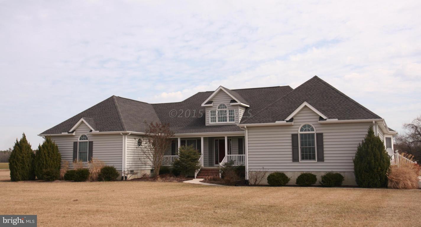 5607 Lone Pine Road Rhodesdale, MD 21659 - Photo 1 of 38 a front view of a house with a yard