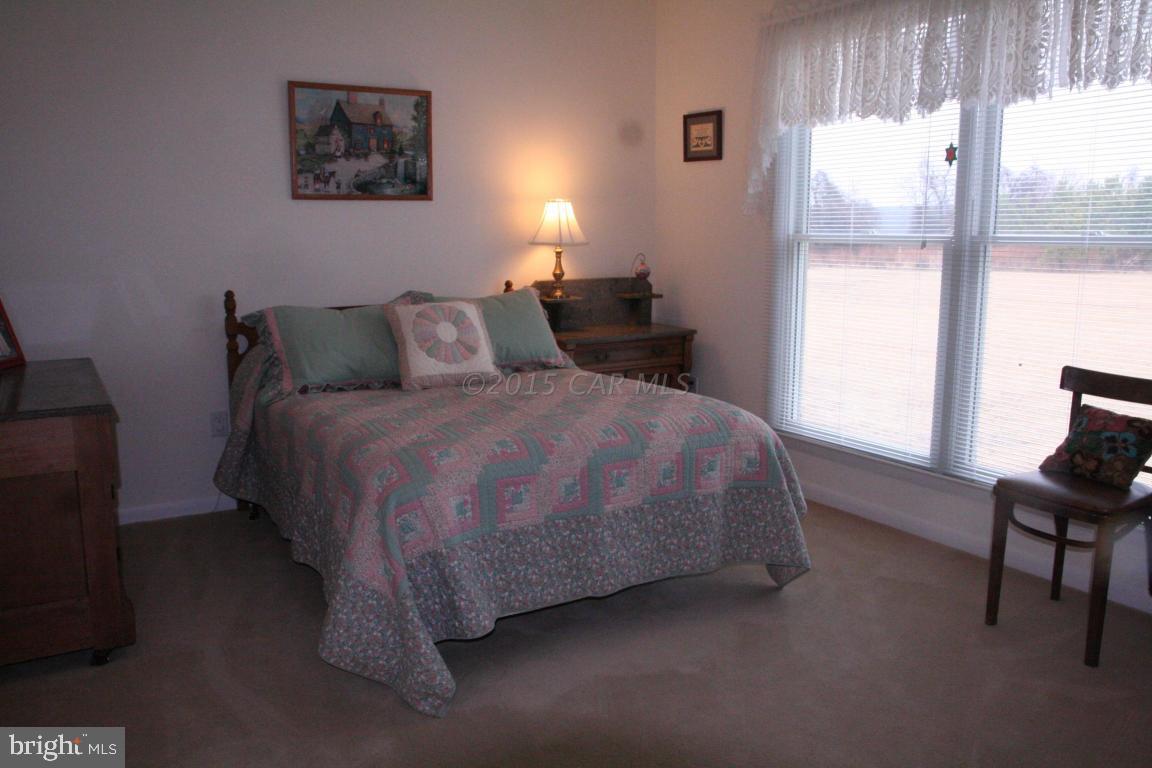 5607 Lone Pine Road Rhodesdale, MD 21659 - Photo 20 of 38 a bedroom with a bed and a window