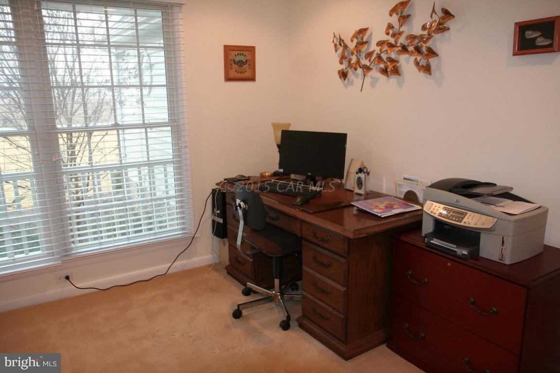 5607 Lone Pine Road Rhodesdale, MD 21659 - Photo 22 of 38 a view of a workspace with furniture and a window