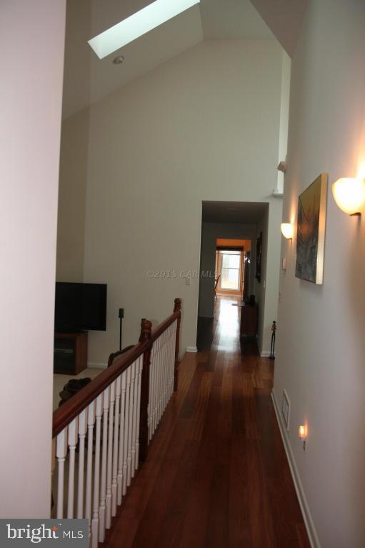5607 Lone Pine Road Rhodesdale, MD 21659 - Photo 24 of 38 a view of a hallway view with wooden floor and staircase