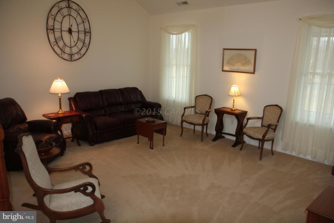 5607 Lone Pine Road Rhodesdale, MD 21659 - Photo 4 of 38 a living room with furniture and a window