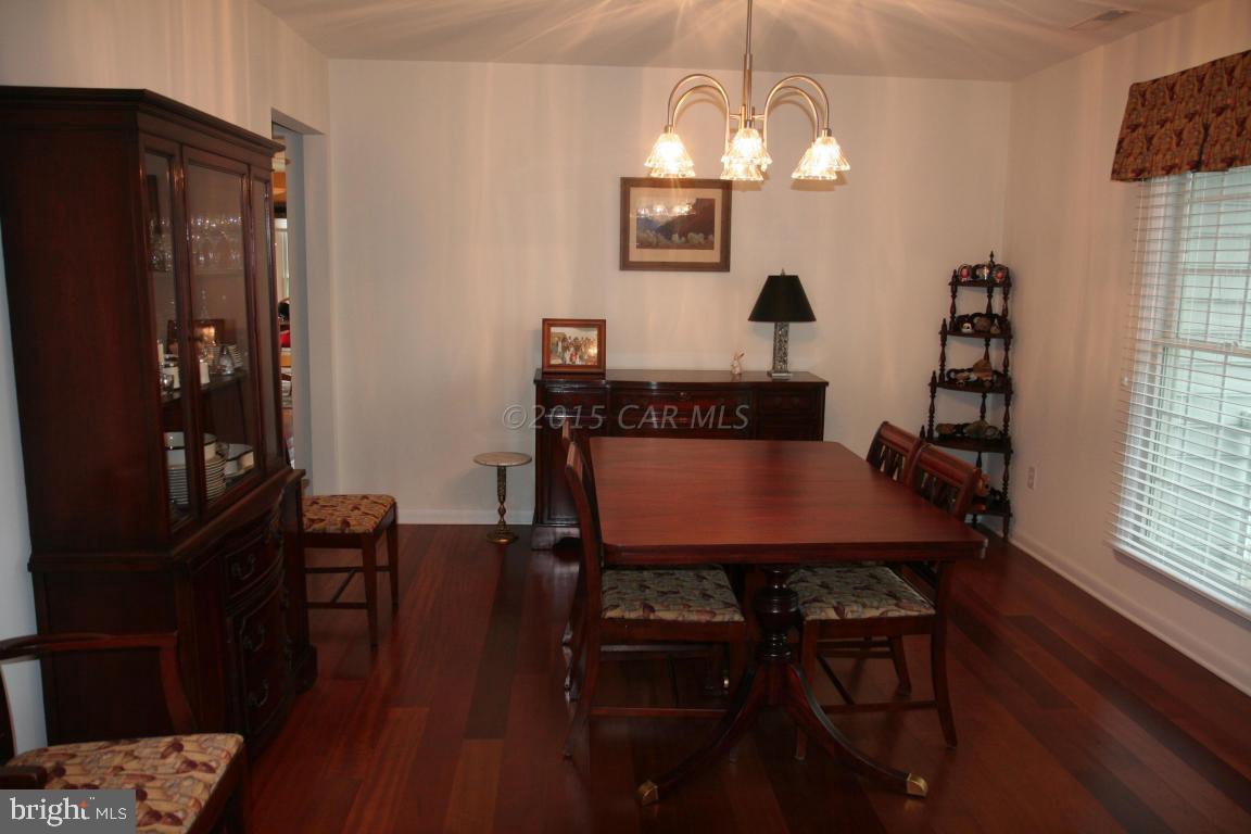 5607 Lone Pine Road Rhodesdale, MD 21659 - Photo 5 of 38 a view of a dining room with furniture window and wooden floor