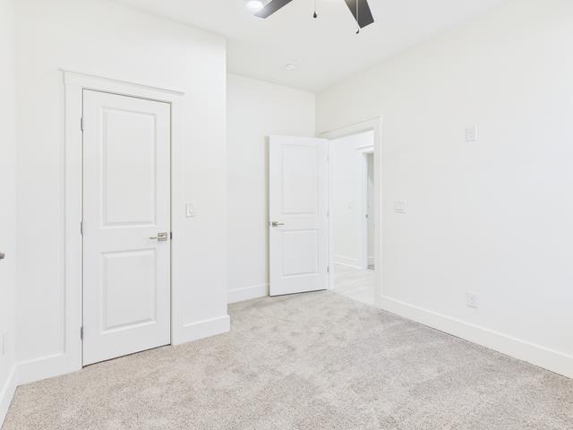 511 Richardson Street Athens, TX 75751 - Photo 26 of 40 Unfurnished bedroom with light carpet and ceiling fan