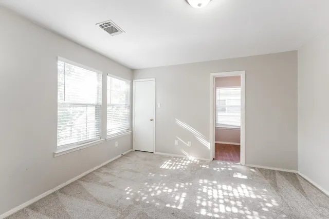 a bathroom with a toilet sink and a window