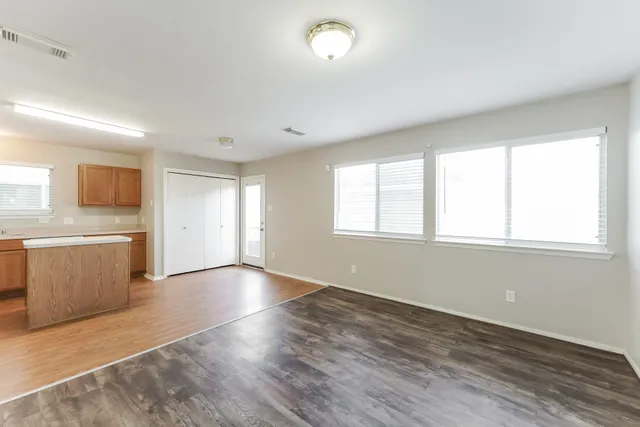 a view of a kitchen with a sink and a window