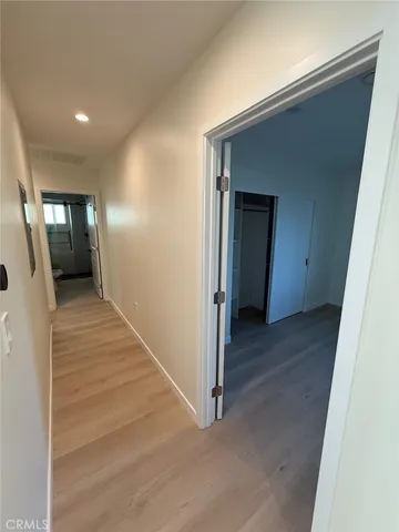 a view of a bathroom from a hallway