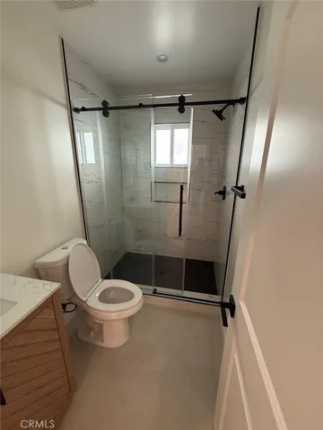 a view of an empty room and wooden floor