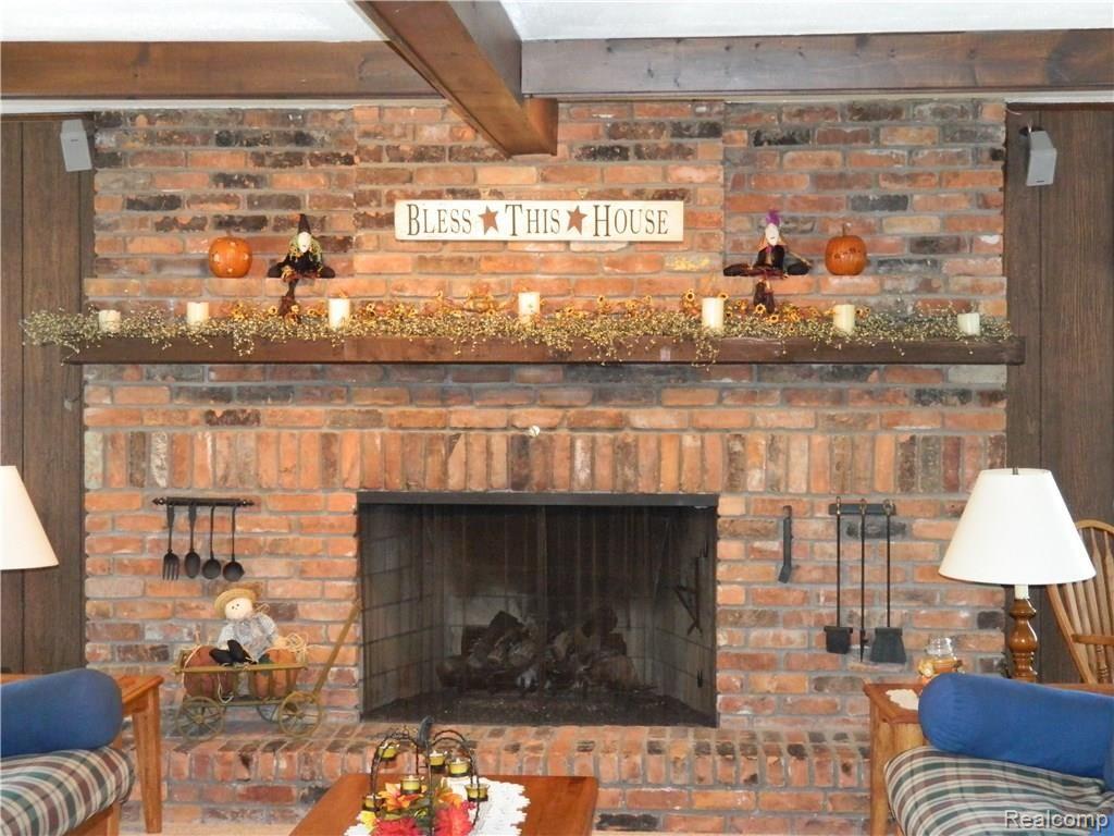 23113 Currie Road South Lyon, MI 48178 - Photo 17 of 49 Family room fireplace