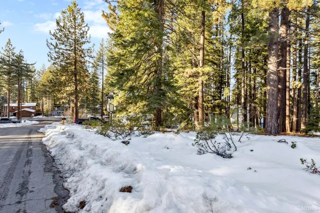 a view of a yard covered with snow