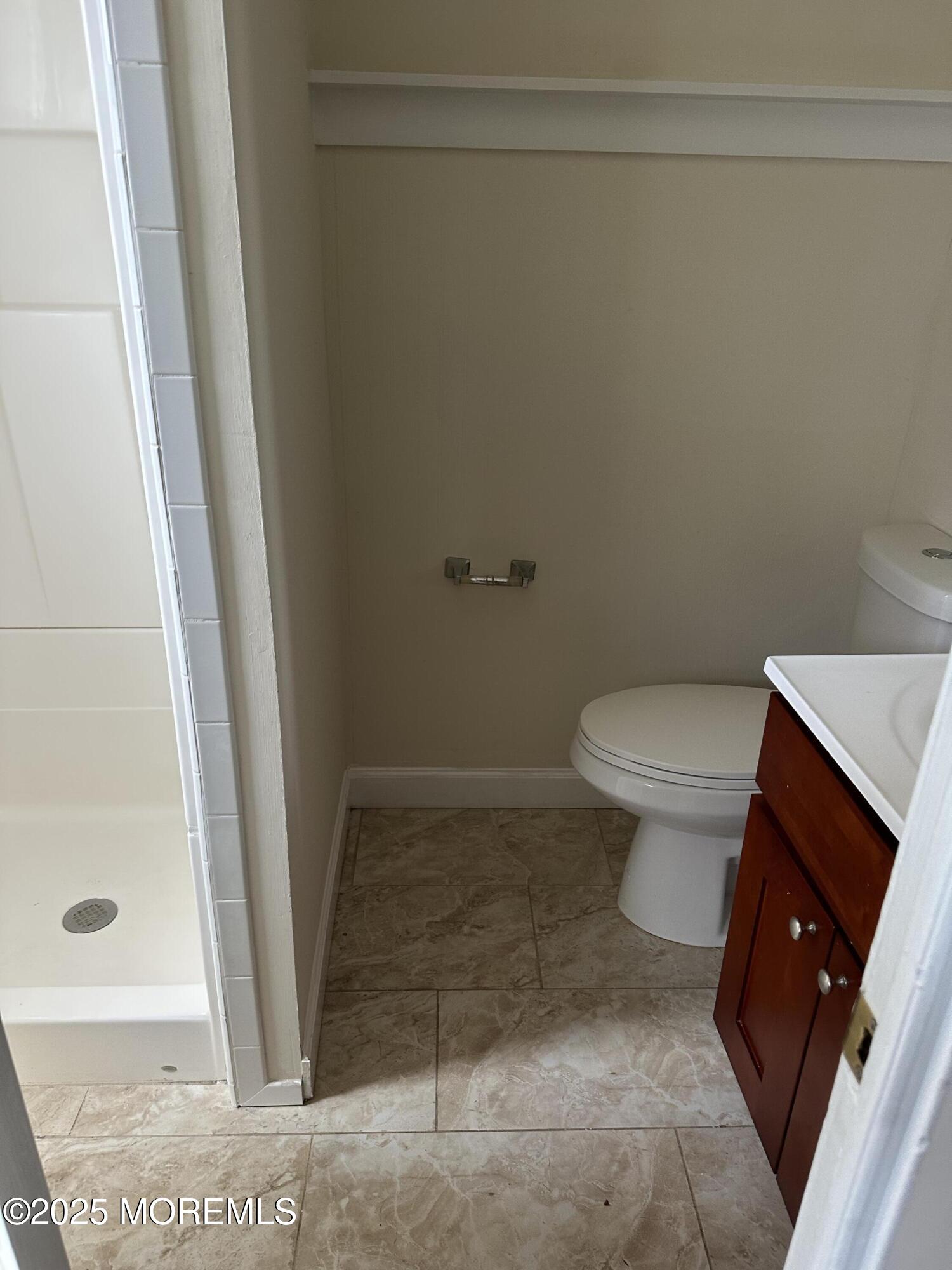 348 Cedar Avenue, Unit 3 Long Branch, NJ 07740 - Photo 8 of 9 a bathroom with a toilet and a shower