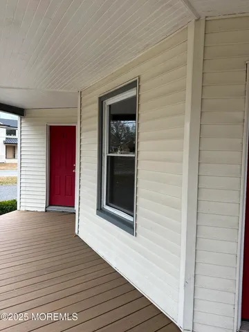 a view of a wooden door and outdoor space