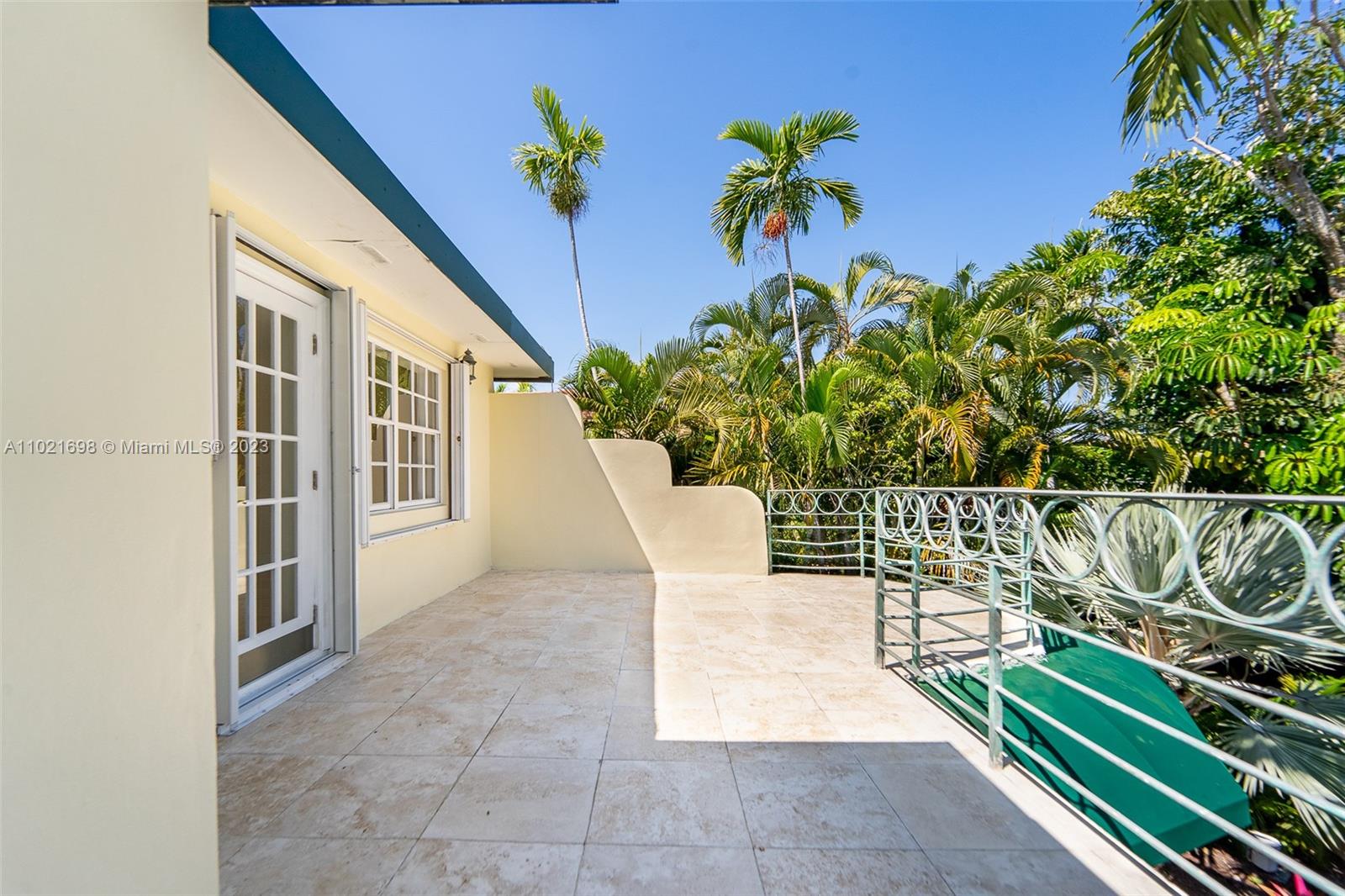 6145 Pine Tree Drive Miami Beach, FL 33140 - Photo 6 of 13 a view of a chairs and table in the patio