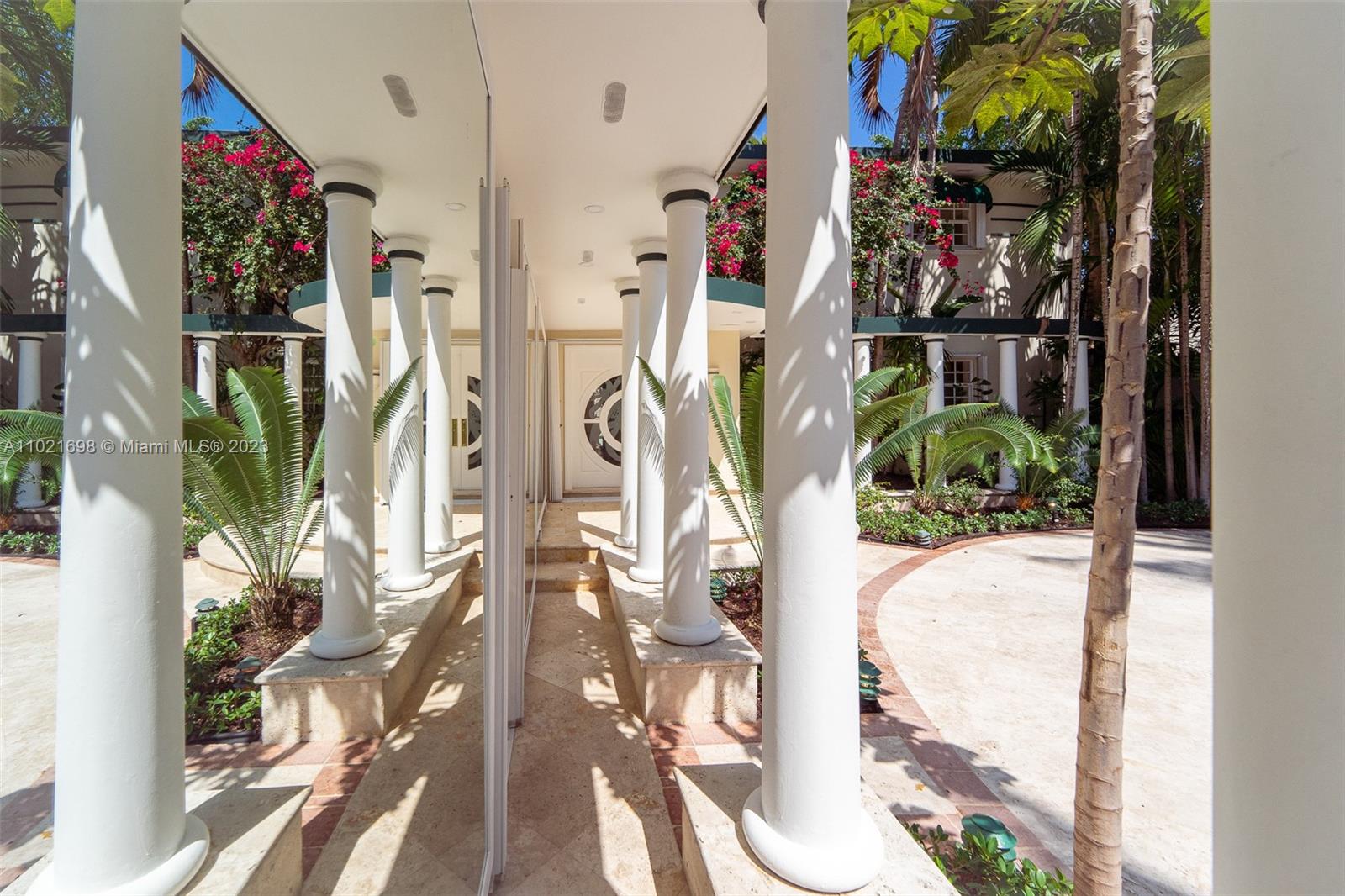 6145 Pine Tree Drive Miami Beach, FL 33140 - Photo 7 of 13 a view of entryway and hall with wooden floor