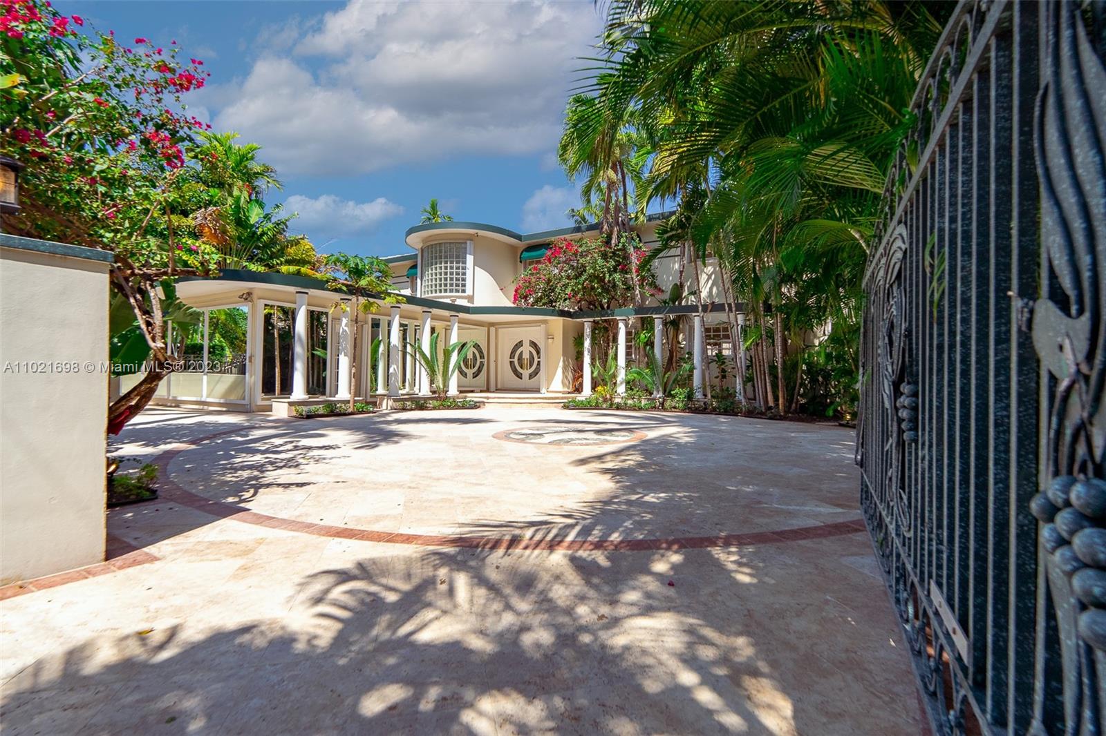 6145 Pine Tree Drive Miami Beach, FL 33140 - Photo 8 of 13 a view of a house with a yard
