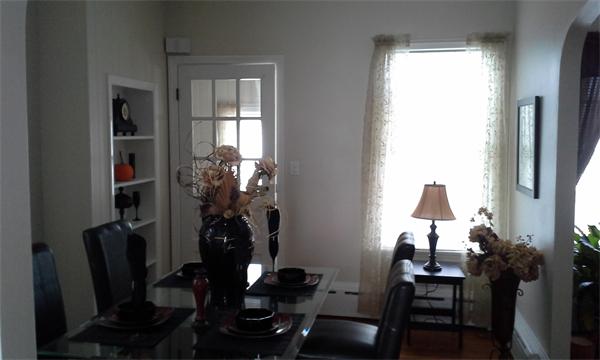 543 Jackson Street Fall River, MA 02721 - Photo 6 of 13 a view of a workspace room with furniture and a window