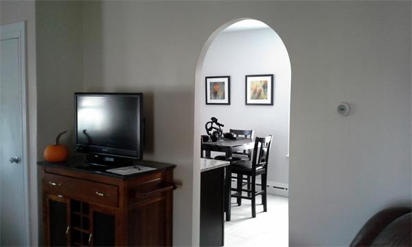 543 Jackson Street Fall River, MA 02721 - Photo 8 of 13 a view of a workspace room with wooden floor and furniture