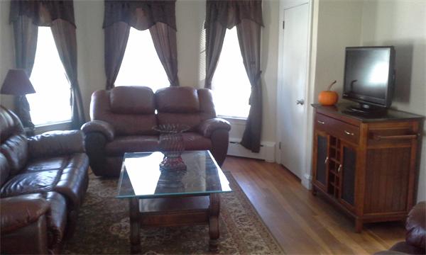 543 Jackson Street Fall River, MA 02721 - Photo 9 of 13 a living room with furniture and a window