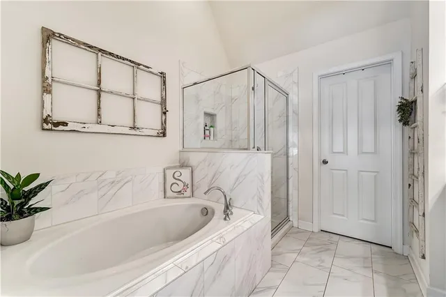 a en suite bathroom with a double sink and mirror