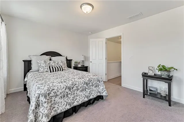 a bathroom with a sink a toilet and shower curtain