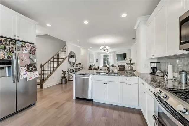 a kitchen with a table and chairs in it