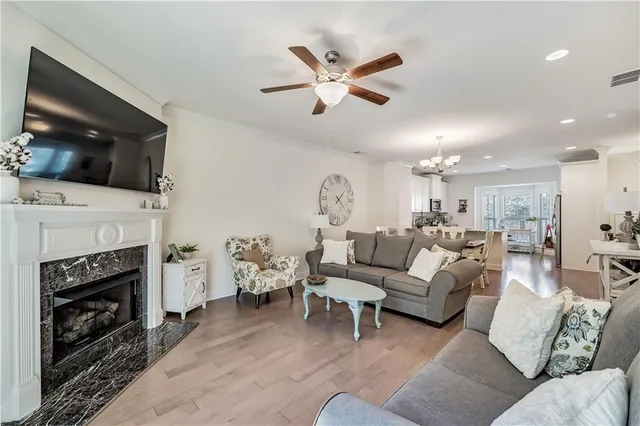 a view of a chair and tables in the balcony