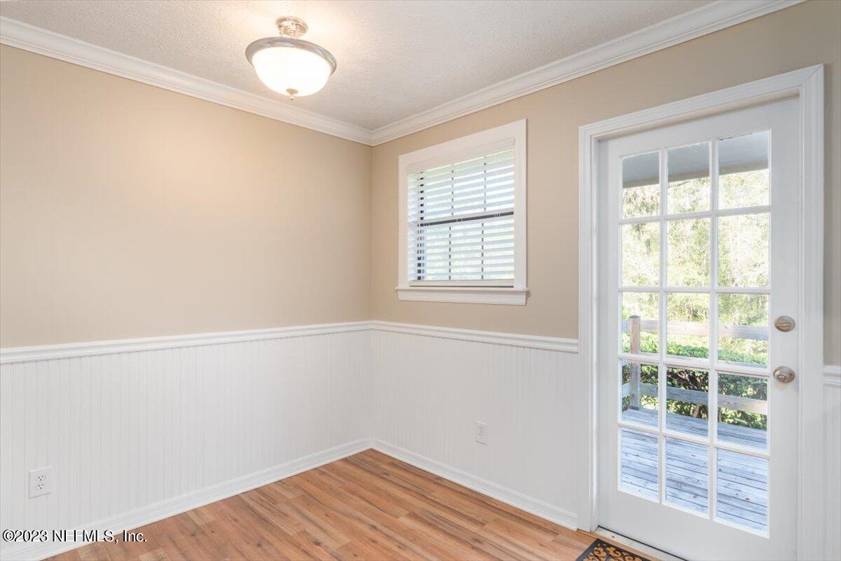 1575 Hardy Padgett Road Jacksonville, FL 32234 - Photo 14 of 43 an empty room with wooden floor and windows