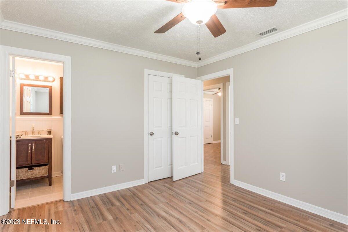 1575 Hardy Padgett Road Jacksonville, FL 32234 - Photo 18 of 43 wooden floor in an empty room with a window