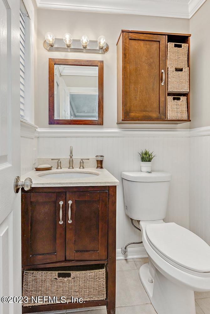 1575 Hardy Padgett Road Jacksonville, FL 32234 - Photo 19 of 43 a bathroom with a granite countertop toilet sink and mirror