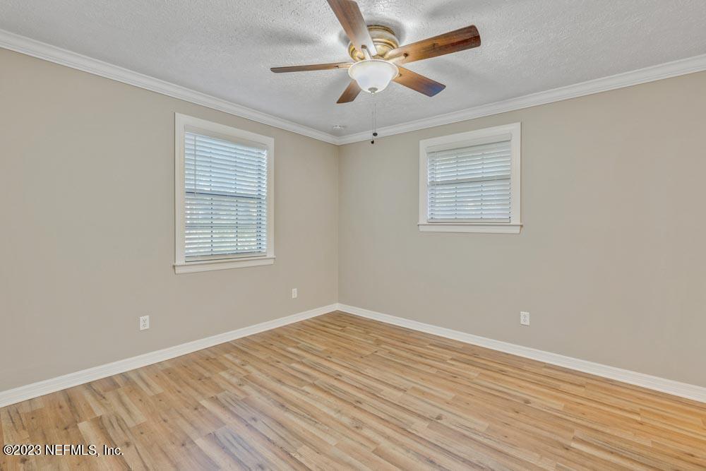 1575 Hardy Padgett Road Jacksonville, FL 32234 - Photo 20 of 43 a view of empty room with wooden floor and fan