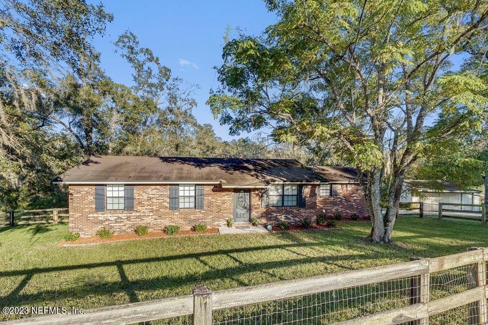 1575 Hardy Padgett Road Jacksonville, FL 32234 - Photo 2 of 43 front view of a house with a yard