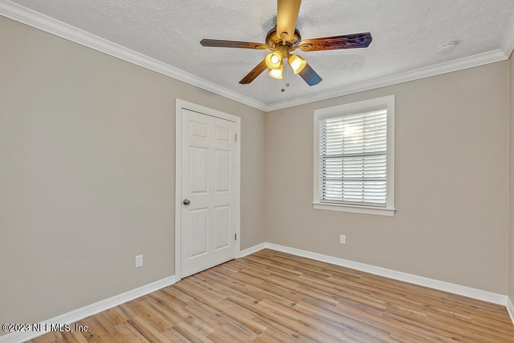 1575 Hardy Padgett Road Jacksonville, FL 32234 - Photo 21 of 43 wooden floor in an empty room with a window