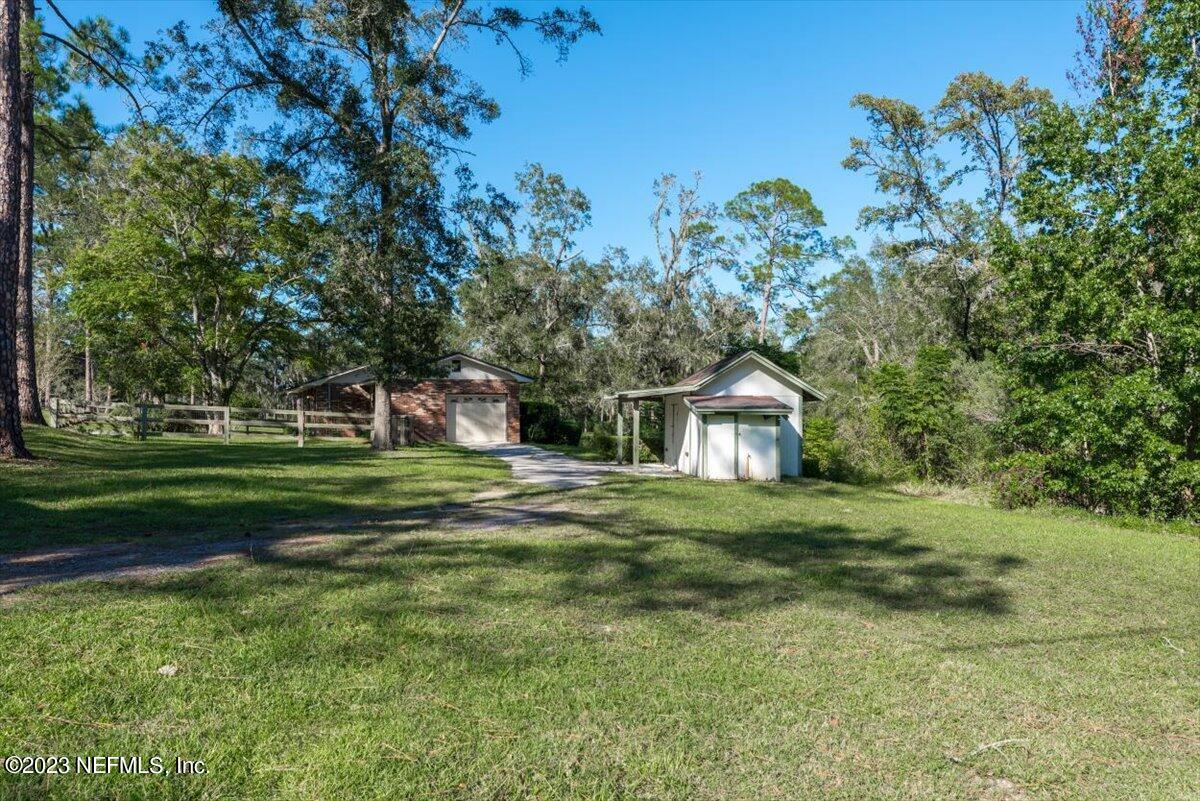 1575 Hardy Padgett Road Jacksonville, FL 32234 - Photo 29 of 43 a front view of a house with a yard