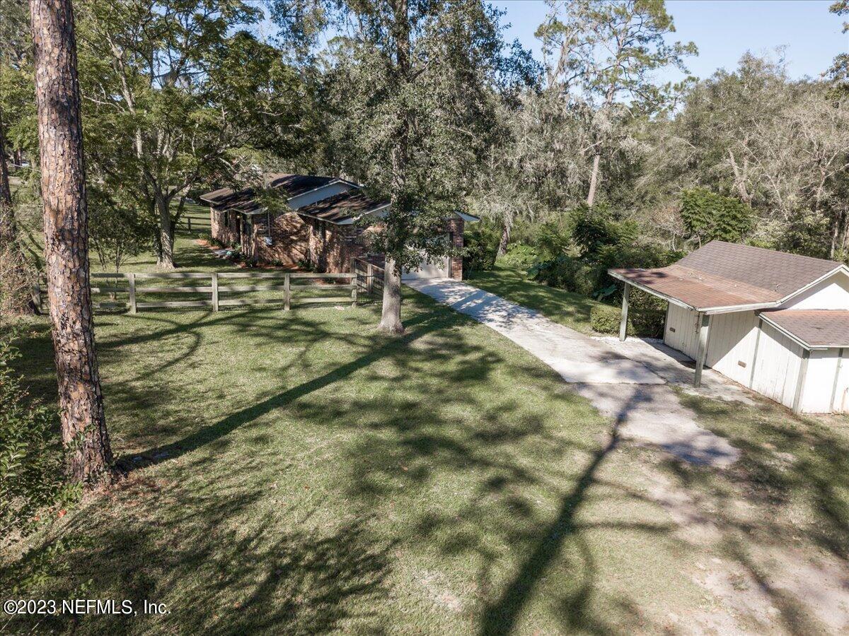 1575 Hardy Padgett Road Jacksonville, FL 32234 - Photo 38 of 43 a view of a yard with table and chairs