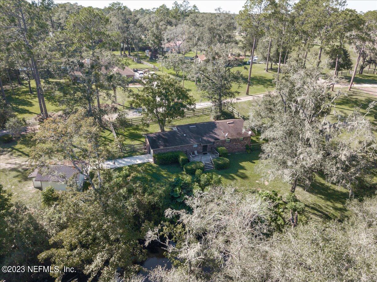 1575 Hardy Padgett Road Jacksonville, FL 32234 - Photo 39 of 43 a view of a lush green forest with lots of trees