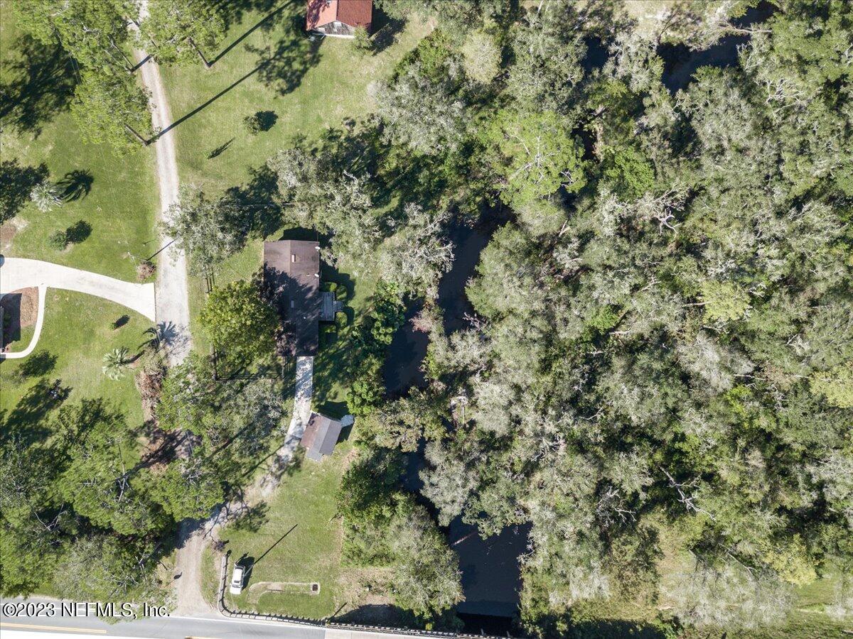 1575 Hardy Padgett Road Jacksonville, FL 32234 - Photo 40 of 43 a backyard of a building with lots of green space