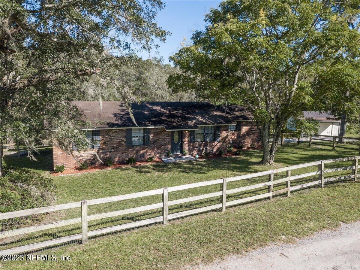 1575 Hardy Padgett Road Jacksonville, FL 32234 - Photo 42 of 43 a view of backyard with deck and a garden