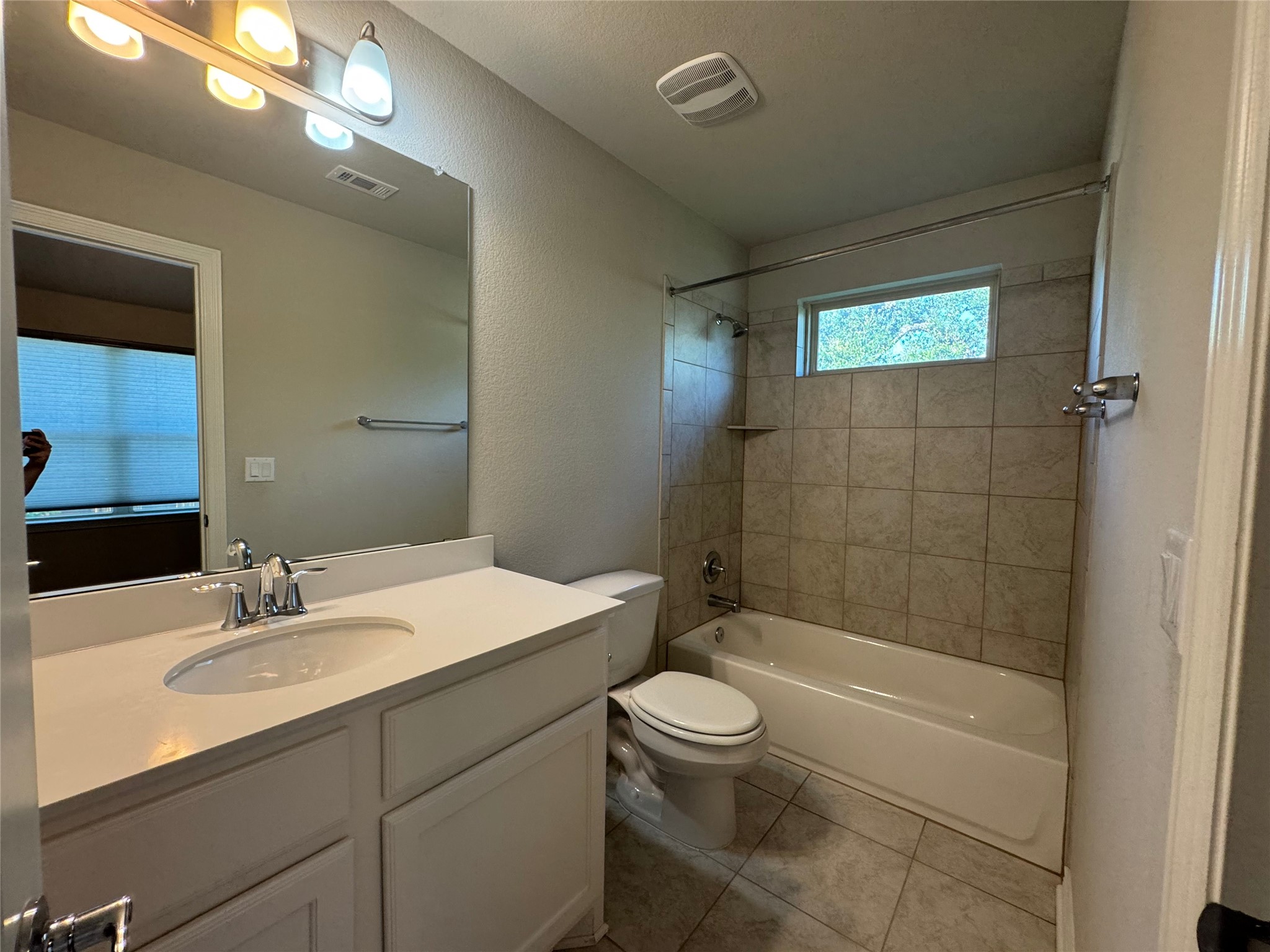 14100 McCoy Loop, Unit 1 Austin, TX 78717 - Photo 25 of 39 Well-appointed bathroom showcasing a convenient shower-over-tub combination and a single vanity.