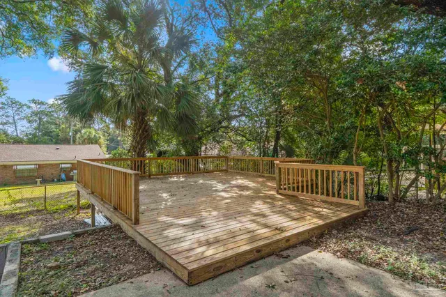 a view of a backyard with trees