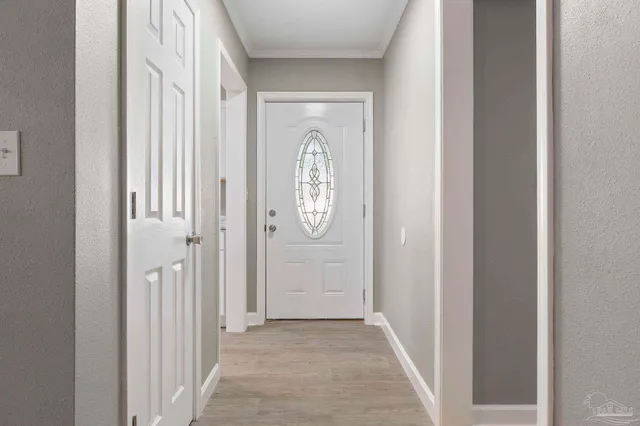 a view of a hallway with windows