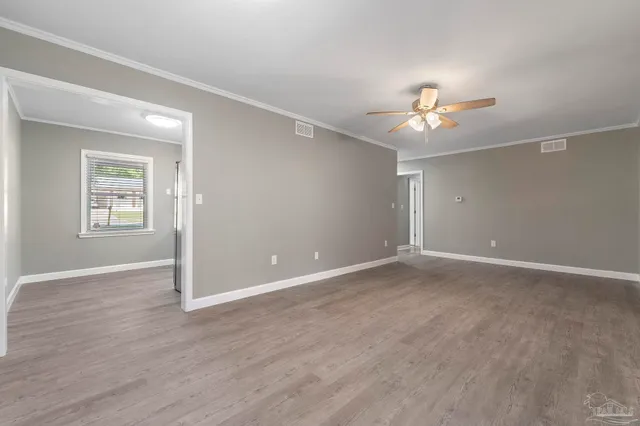 a view of an empty room with a window